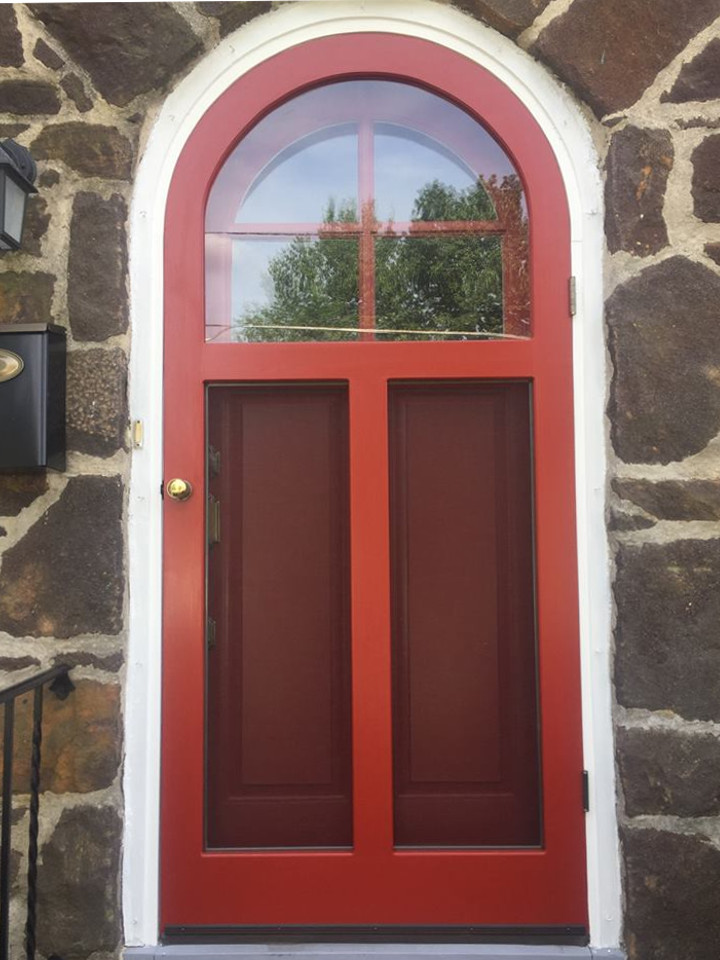 round top wood storm door - a pop of red for your home