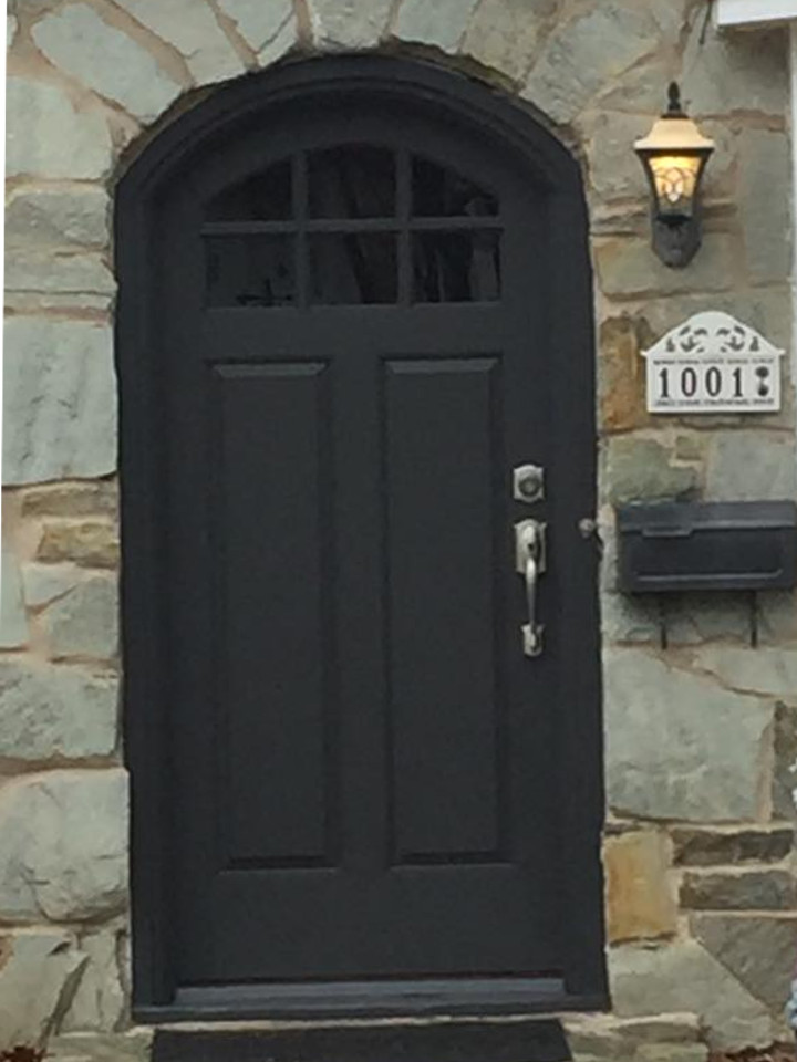 black arch top entry door