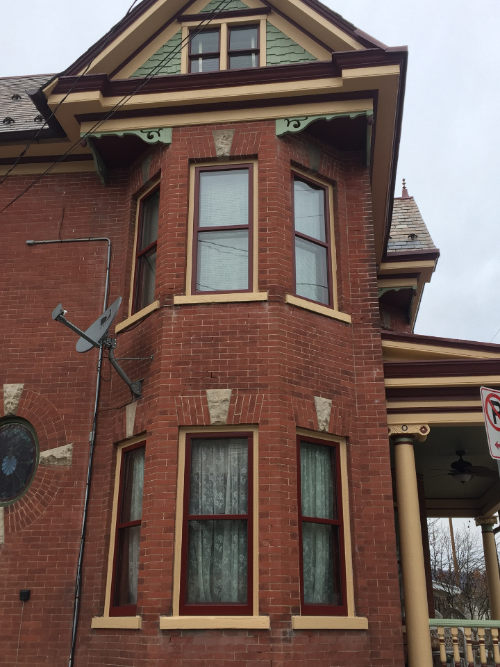 victorian home with custom storm windows