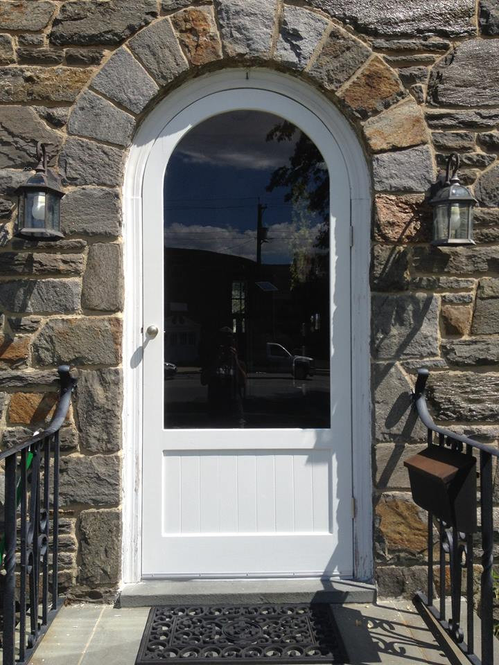 white arched top door