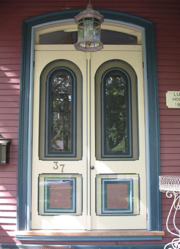 arched double wood storm doors from Victoriana East